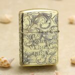 1935 Varga Girl Zippo Armor lighter lettering and scrollwork close-up