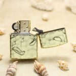 Open Buddha Relief Zippo Armor lighter with pale green textured panels