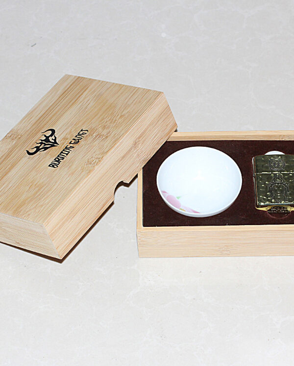 KZ204-07 Open wooden box showing a small white ceramic bowl and a gold-tone lighter in a brown foam insert within the box.