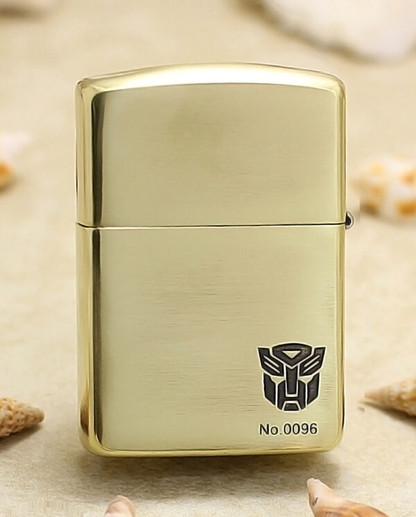 KZ206-01 Gold metal lighter with brushed finish, showing the Transformers Autobot logo and No.0096.