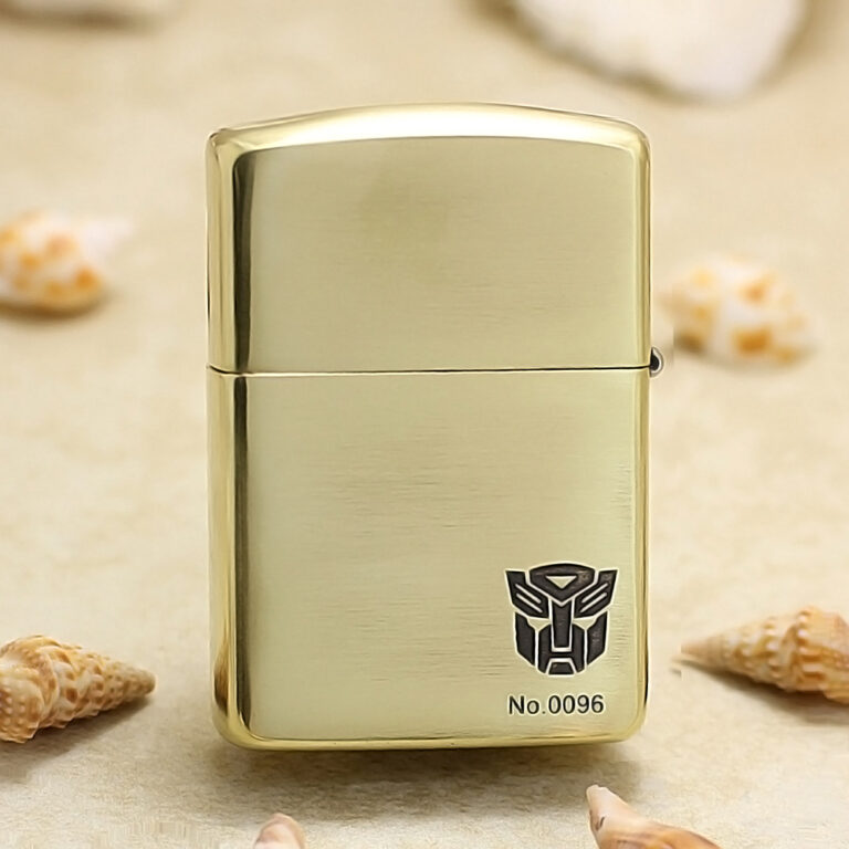 Gold metal lighter with brushed finish, showing the Transformers Autobot logo and No.0096.