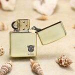 Open Transformers brass Zippo Armor lighter with Autobot emblem