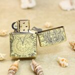 Open Guardian Angel Zippo Armor lighter showing ornate reverse engraving