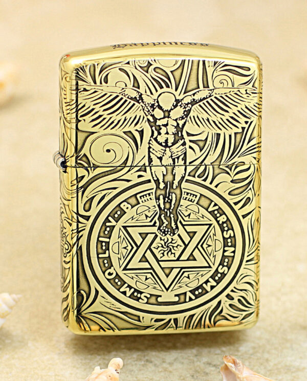 KZ211 Gold-tone Zippo lighter with black engraving of a winged figure above a circular mystical symbol with a six-pointed star.