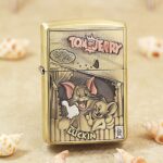 Tom and Jerry brass Zippo Armor lighter with vintage cartoon engraving