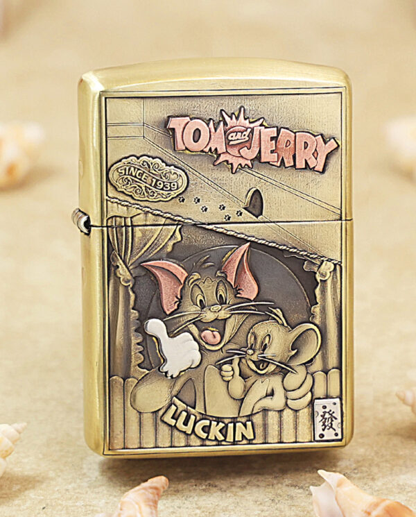 Gold-tone lighter featuring a Tom and Jerry cartoon, with a 'LUCKIN' label at the bottom and a vintage badge reading 'Since 1939'.