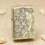 Arabesque woman brass Zippo Armor lighter with ornate scroll engraving