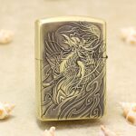 Phoenix Zippo Armor lighter with flowing feather and ornamental engraving