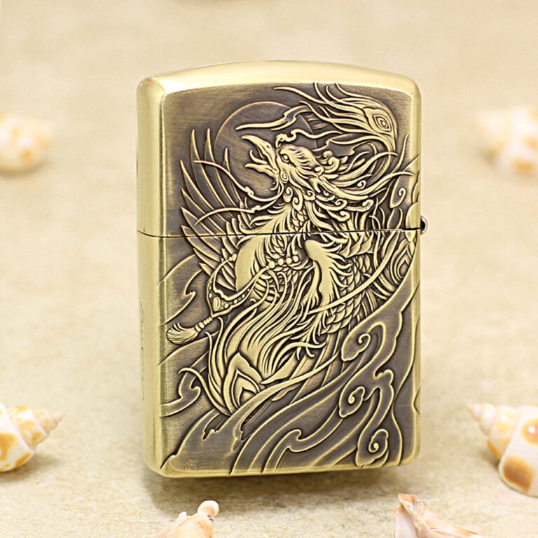 Brass Zippo-style lighter with an ornate, engraved dragon and swirling wave patterns on the front surface.