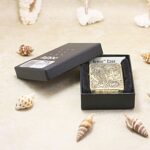 Phoenix brass Zippo Armor lighter in open Armor Case box
