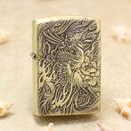 Brass Zippo-style lighter with an intricate carved dragon and floral design on the front.
