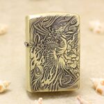 Phoenix brass Zippo Armor lighter with detailed engraved bird artwork