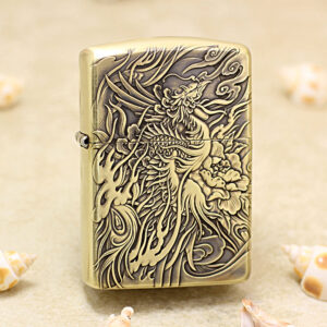 Brass Zippo-style lighter with an intricate carved dragon and floral design on the front.