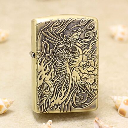 Phoenix brass Zippo Armor lighter with detailed engraved bird artwork