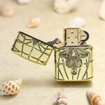 Open Spider-Man brass Zippo Armor lighter with engraved side artwork