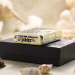 Dangerous Skull brass Zippo Armor lighter displayed on presentation box