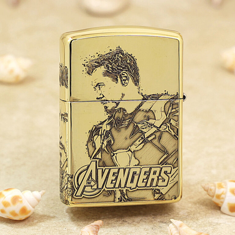 Gold-colored lighter featuring a stylized Avengers illustration and the Avengers logo at the bottom.