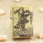 Gold-toned Zippo-style lighter featuring Marvel's Avengers and Iron Man artwork on the front.