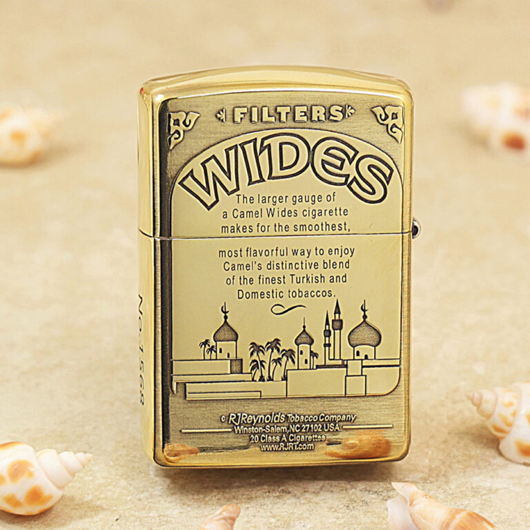 Gold Zippo-style lighter with 'WIDES' branding and a skyline illustration on the front, resembling a mosque and palm trees.