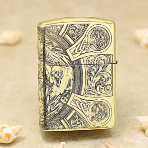 Gold Zippo lighter with ornate medieval engraving, including a hooded figure and intricate knotwork.