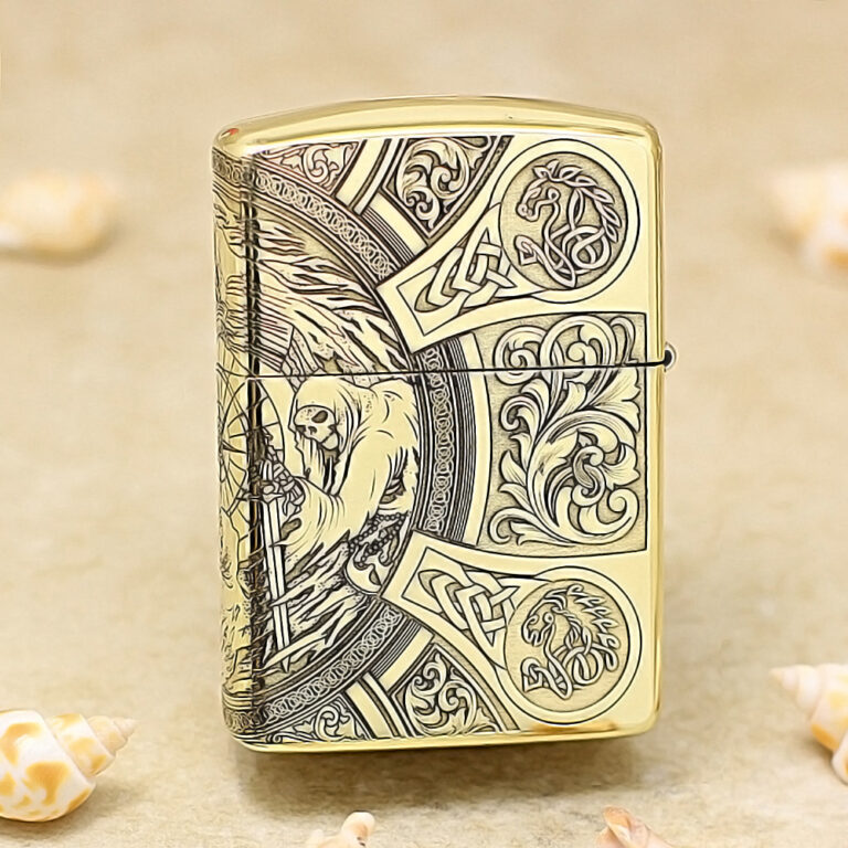Gold Zippo lighter with ornate medieval engraving, including a hooded figure and intricate knotwork.
