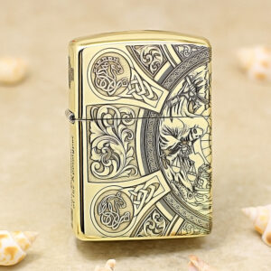Gold Zippo lighter with intricate Celtic knotwork and floral engravings on its surface.