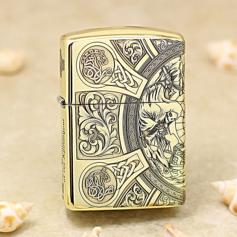 Gold Zippo lighter with intricate Celtic knotwork and floral engravings on its surface.