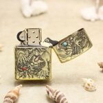 Open ornate dragon Zippo Armor lighter showing relief-style engraving