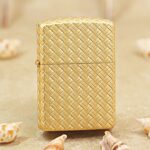 Gold-tone woven braid pattern Zippo Armor lighter front view