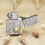 Open Golden Woman Arabesque Zippo Armor lighter showing skull artwork