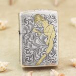 Golden Woman silver-tone Zippo Armor lighter with arabesque engraving