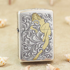 Lighter with ornate black-and-white scrollwork and a stylized nude woman illustration in gold tones.