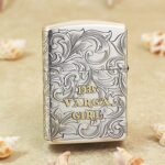 Varga Girl Windy Zippo Armor lighter with 1935 lettering and arabesque engraving