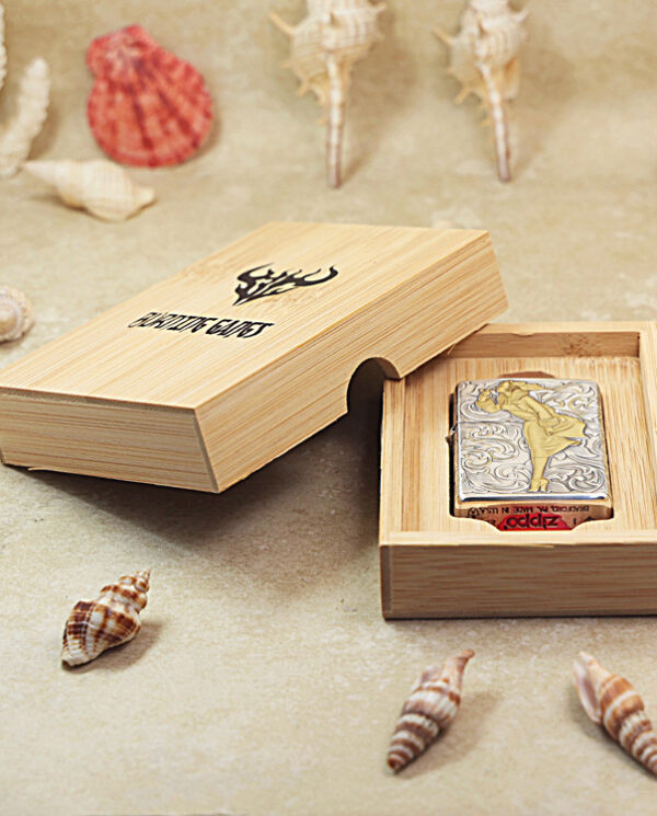 KZ287-06 Open wooden gift box revealing a decorative Zippo lighter inside; seashells surround the display.