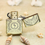 Open White Tara brass Zippo Armor lighter showing reverse engraving