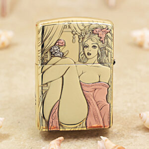 Gold-colored lighter with a pin-up style illustration of a woman in a pink dress seated with legs raised, set against a curtained backdrop on the lid and body.