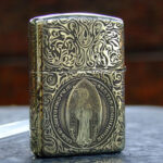 KZ252 Zippo Armor brass St Benedict figure engraved front