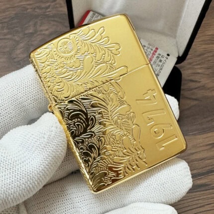 Gold-finish Venetian Zippo with floral engraving and large 1974 date