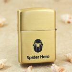 Spider-Man brass Zippo Armor lighter mask and web engraving close-up