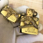 Alien Emblem No. 1 brass Zippo lighter biomechanical engraving detail