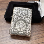 Son of Satan Pentagram sterling silver Zippo Armor lighter – front view showing a pentagram seal framed by dense floral engraving