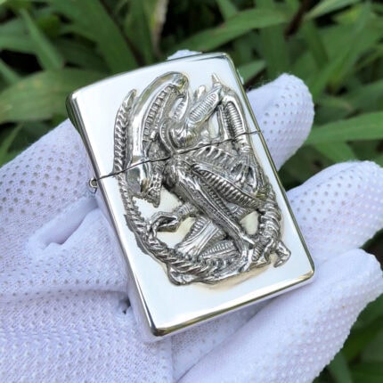 Alien 20th Anniversary Xenomorph sterling silver Zippo lighter – front view showing the full-body Xenomorph sculptural emblem