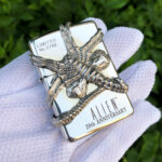 Alien 20th Anniversary Facehugger sterling silver Zippo lighter – front view showing the sculptural Facehugger, Alien 20th Anniversary lettering, and Limited No. 0766