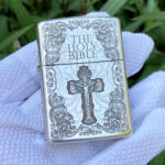 Front view of the Holy Bible and cross multi-side engraved sterling silver Zippo Armor lighter