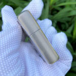 Ribbed narrow side of the Holy Bible sterling silver Zippo Armor lighter