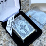 Holy Bible sterling silver Zippo Armor lighter displayed in its original Zippo box