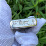 Bottom stamp close-up of the 2019 sterling silver Zippo Armor lighter