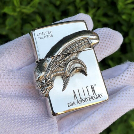 Alien 20th Anniversary Xenomorph Head sterling silver Zippo lighter – front view showing the sculptural Xenomorph head, Alien 20th Anniversary lettering, and Limited No. 0765