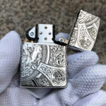 Open Four Horsemen sterling silver Zippo lighter showing the insert and engraved lid