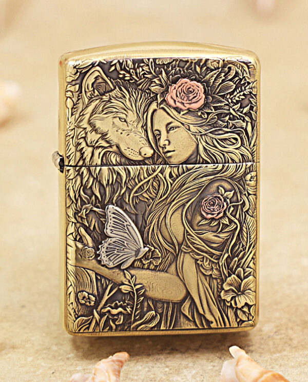 KZ452 Brass lighter with an intricate engraved scene of a woman, a wolf, flowers, and a butterfly.